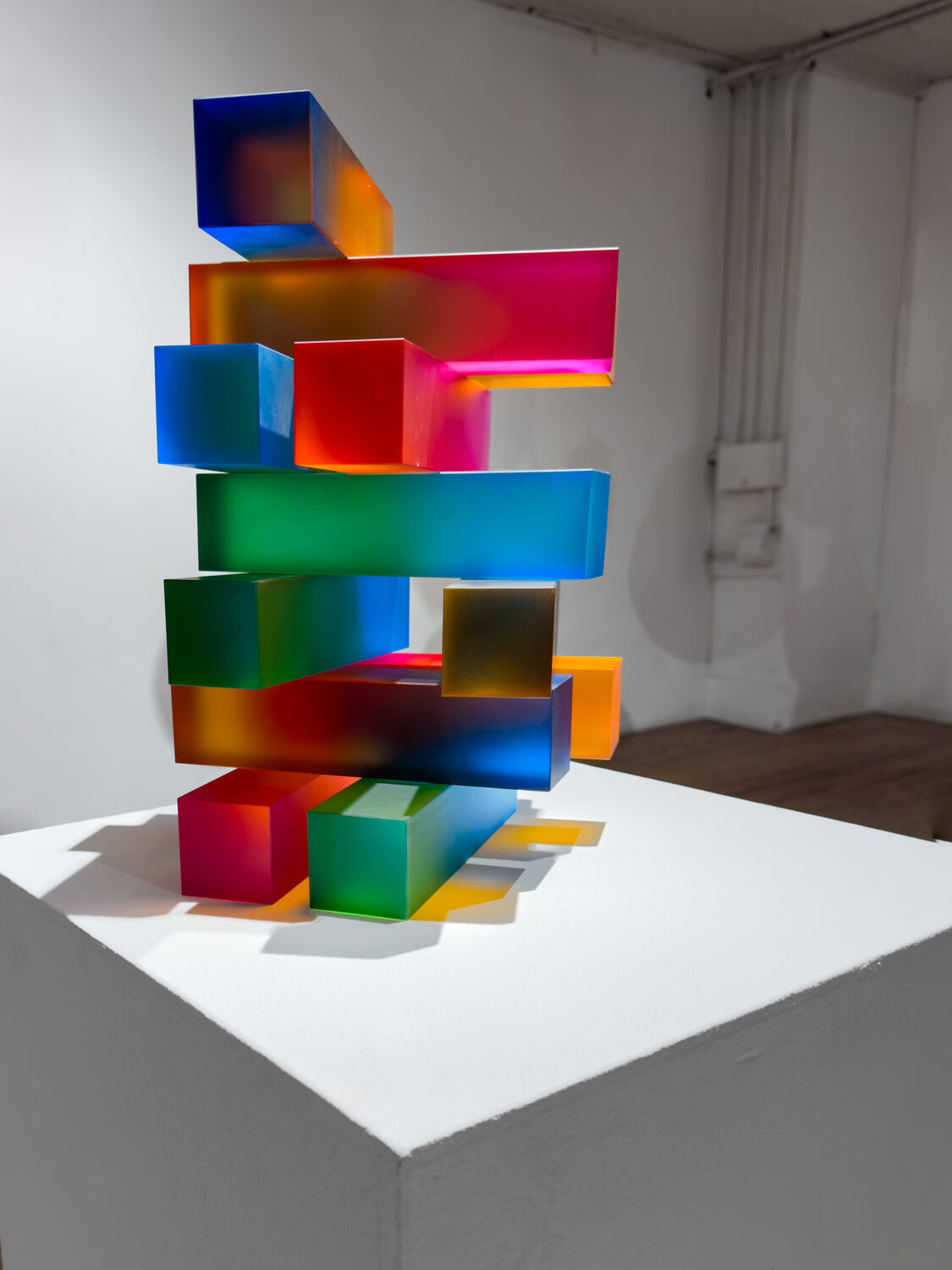 One Radiance Away, a stacked artificial crystal sculpture on a pedestal